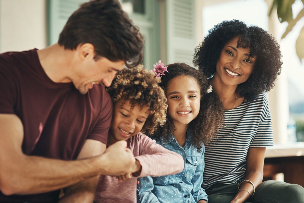 Boys will be boys. Shot of a beautiful young family bonding and spending time together at home.
